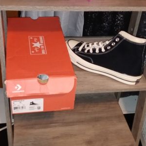 Brand new men converse black and white, never worn. Can pass for women 11.